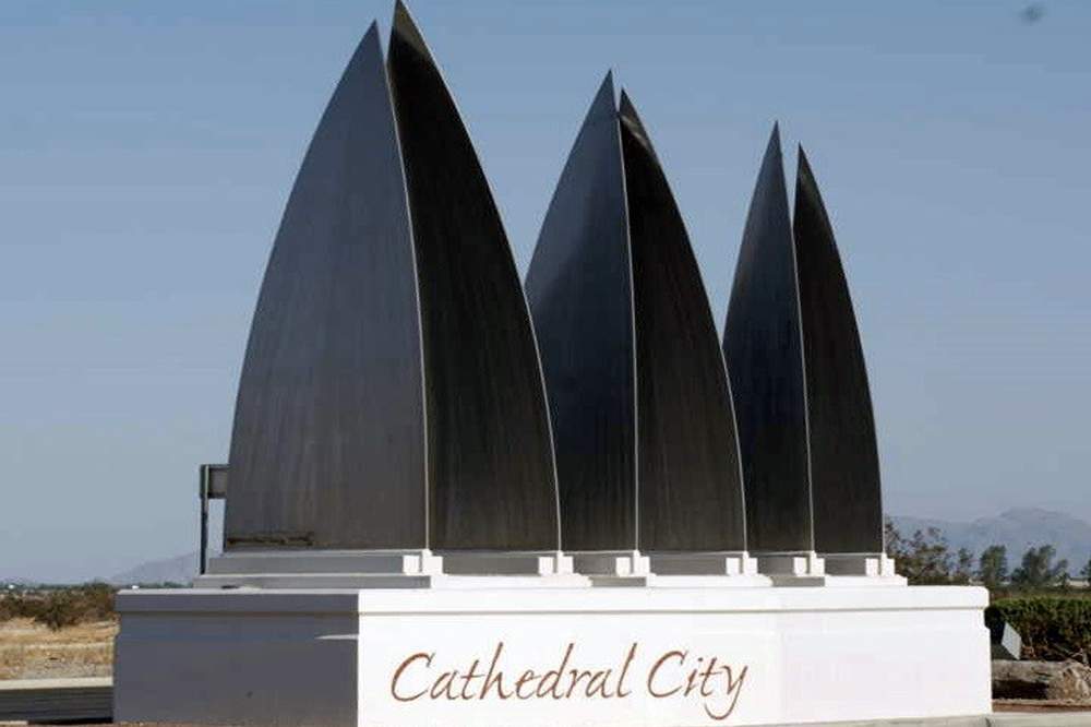 Cathedral City monument with tall black sculptural panels on a white base